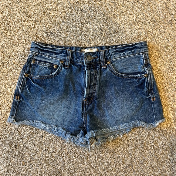 Free People short cut off Jean shorts. 2” inseam. Stretch. Medium wash. Raw hem - Picture 1 of 8